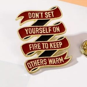 Enamel pin... there pins aren't thin and bendable or cheaply made. Solid as a ro